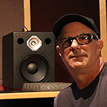 Adam Kagan, L.A. producer, in his mix room with a Wayne Jones Audio 7.1.4 Dolby Atmos studio monitor system.